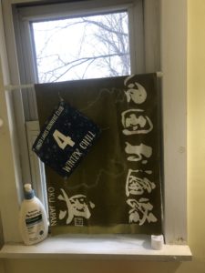 Curtain in window with race number attached