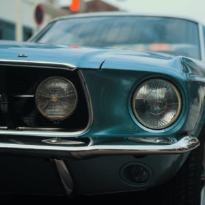 Headlight of blue Ford Mustang