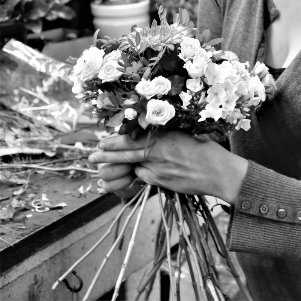 Person arranging flowers