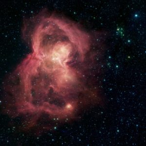 Billowing clouds of pink light in space